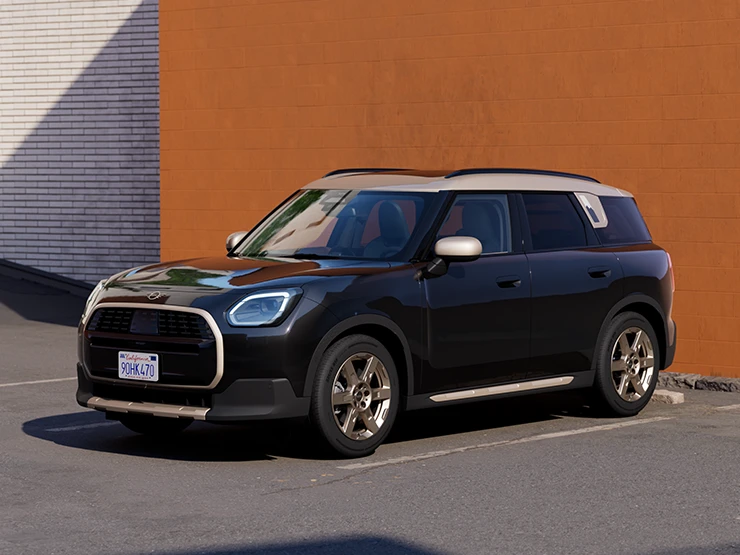Eest külgvaade Midnight Blacki värvitoonis ja Vibrant Silveri katusega MINI Countrymanile parkimas.