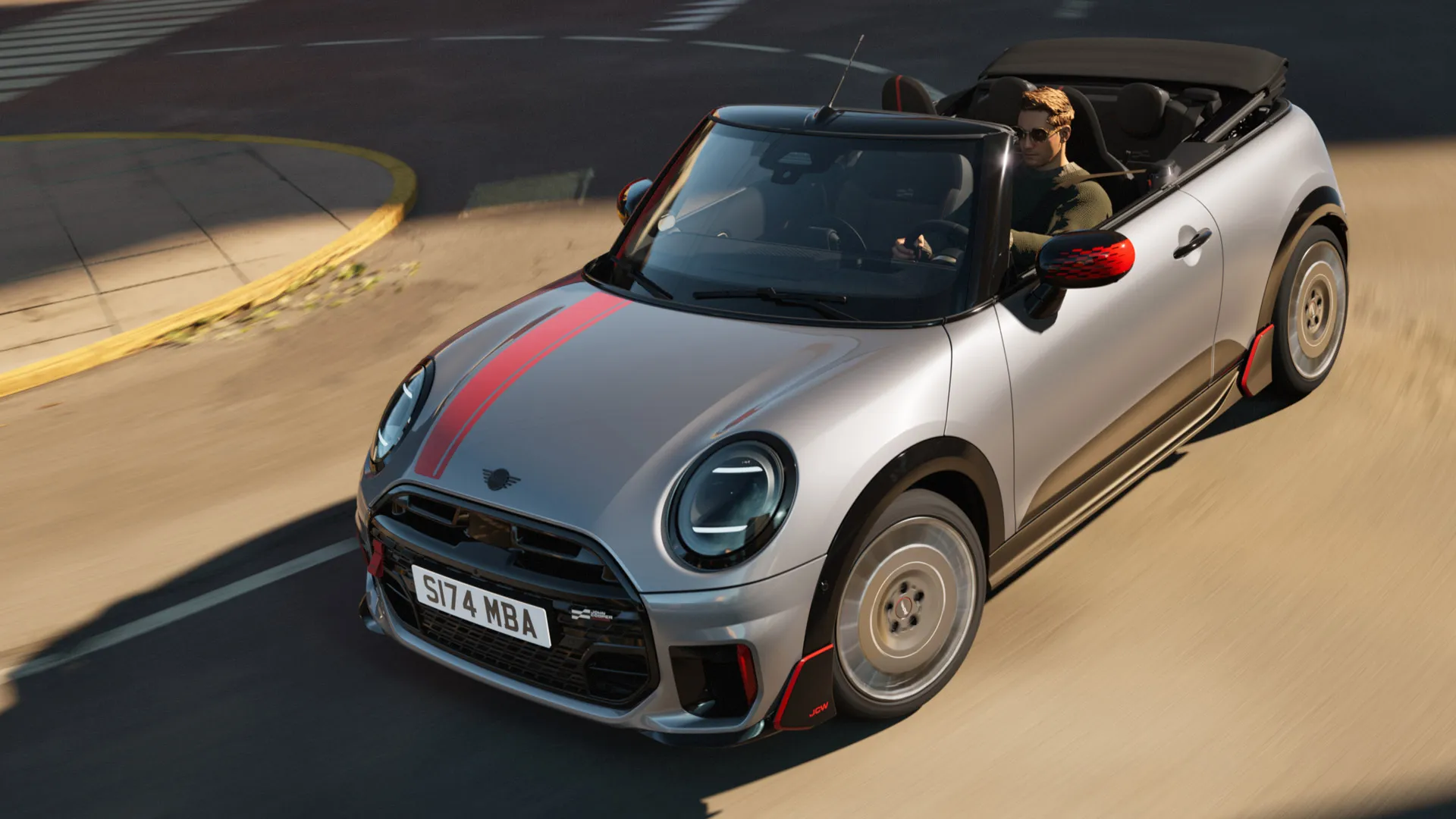 MINI Convertible ülalt eestvaates, John Cooper Worksi kleebistega värvitoonis Chili Red.